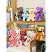 Colorful Bear Doll Plush Toys in various shades including pink, blue, purple, and green displayed on shelves and a chair, perfect for gifting or cuddling.